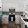 Kitchen with stainless steel appliances and built-in microwave
